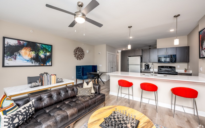 Styled living room with view of kitchen