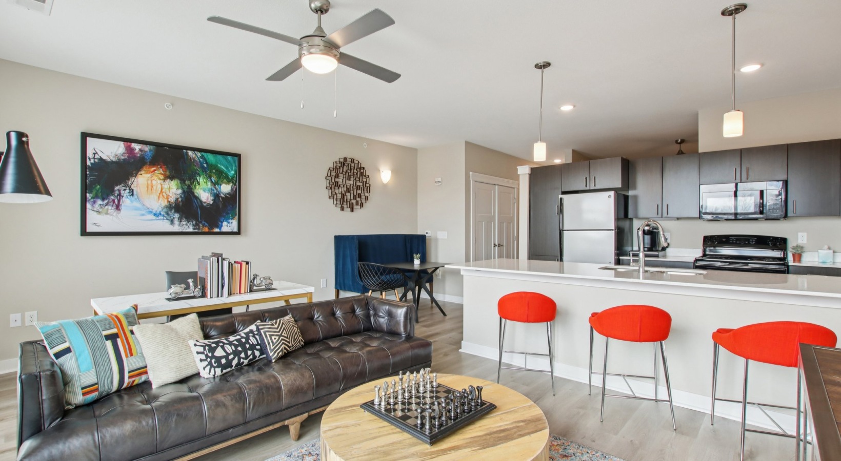 a living room with a table and chairs